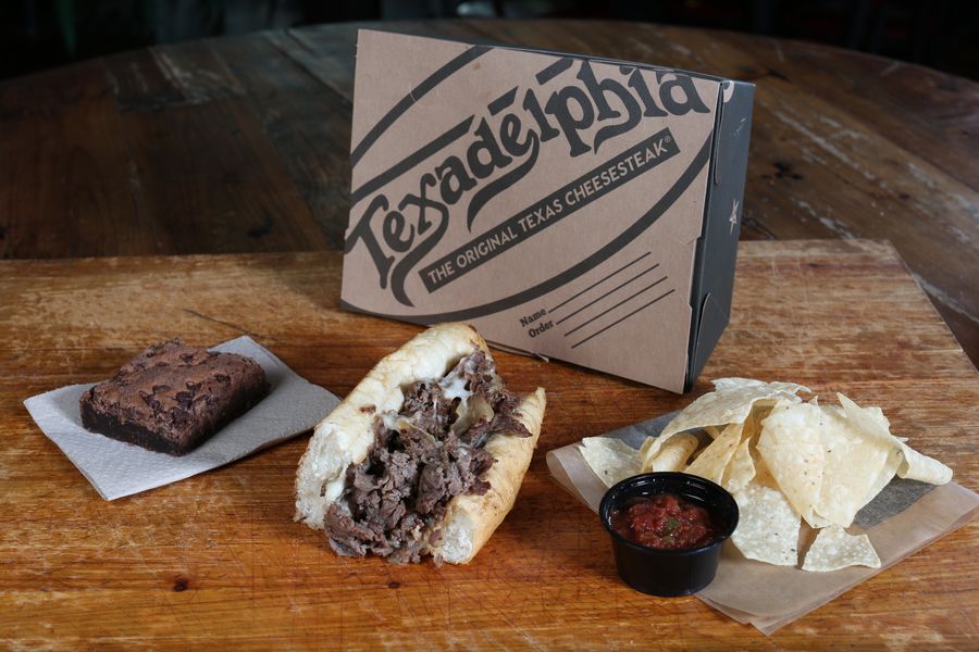 Texadelphia box lunch β cheesesteak, chips and salsa, and a brownie in a branded box